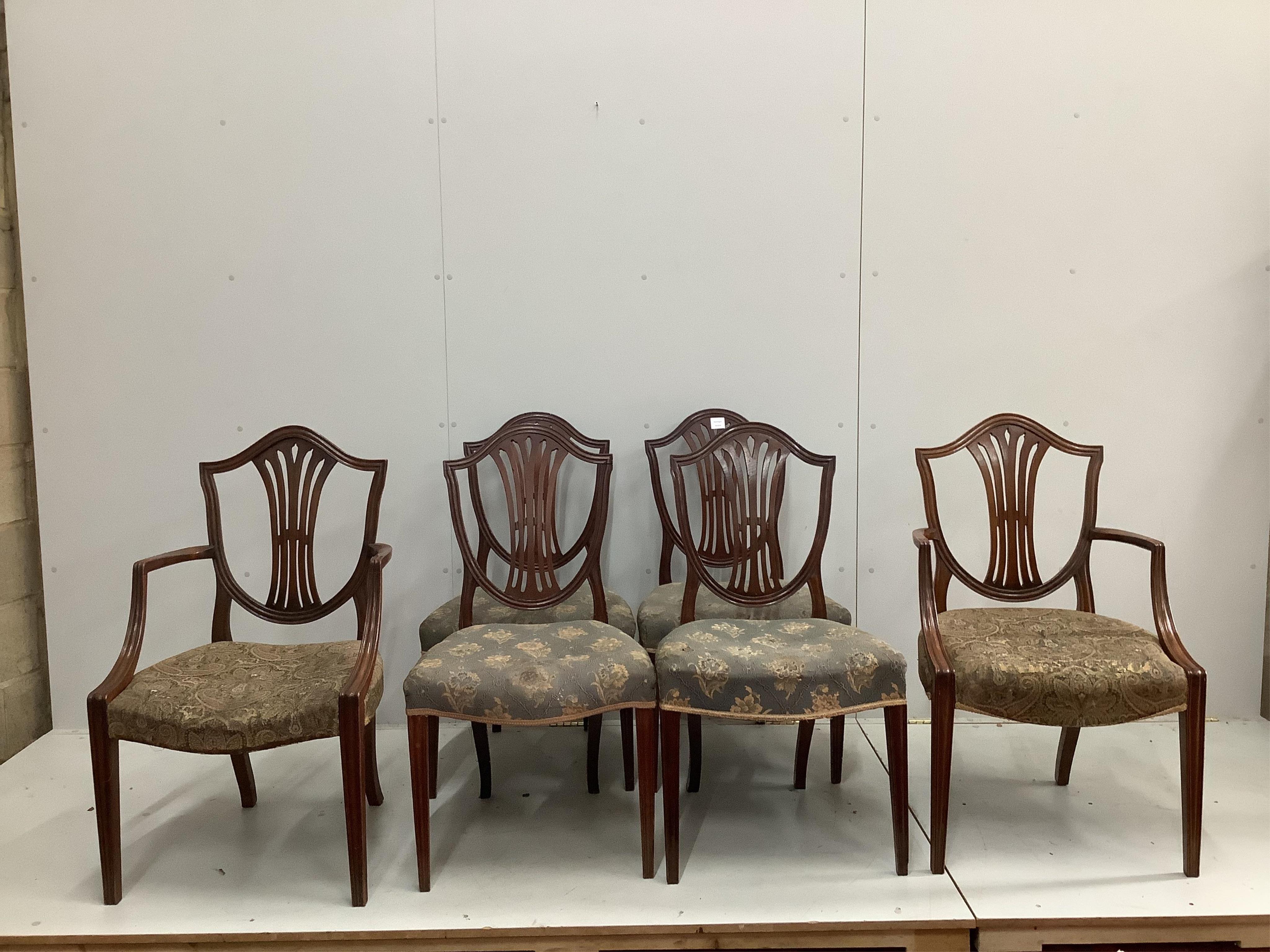 A set of six George III and later mahogany dining chairs, two with arms. Condition - fair